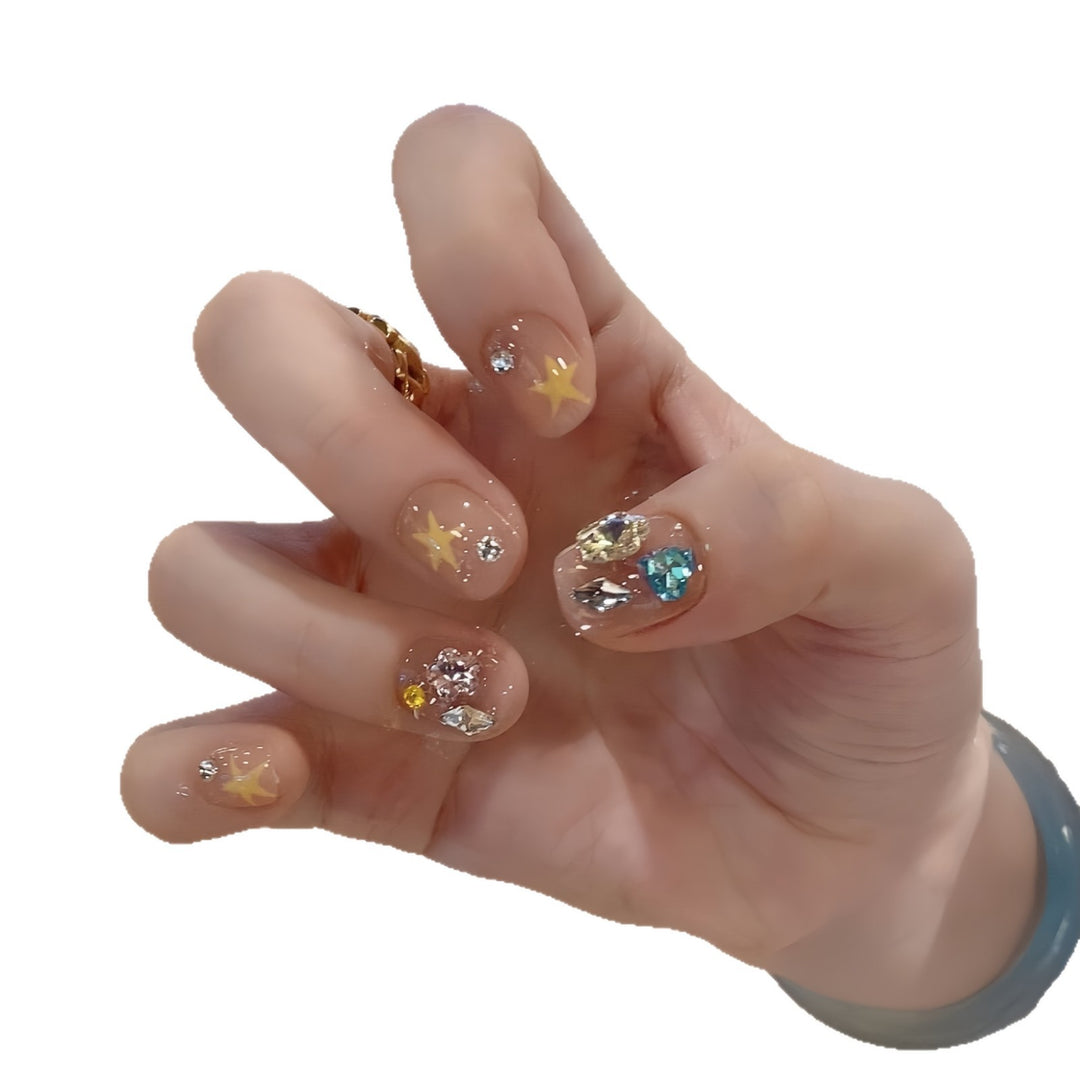 Glittering nail tips with elegant jewelry accents Stornfield