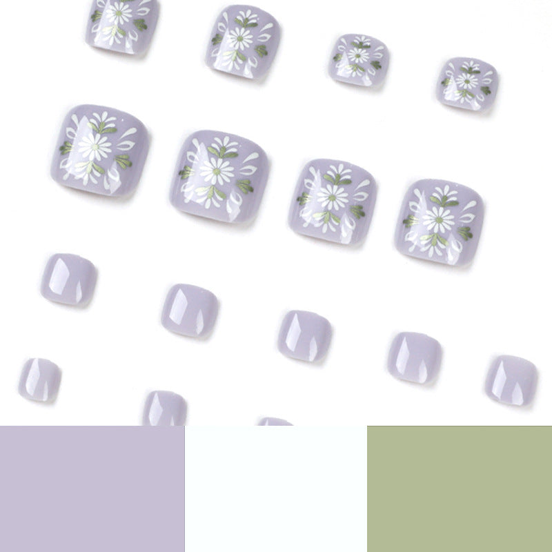 Artistic toenail design with elegant floral design Stornfield