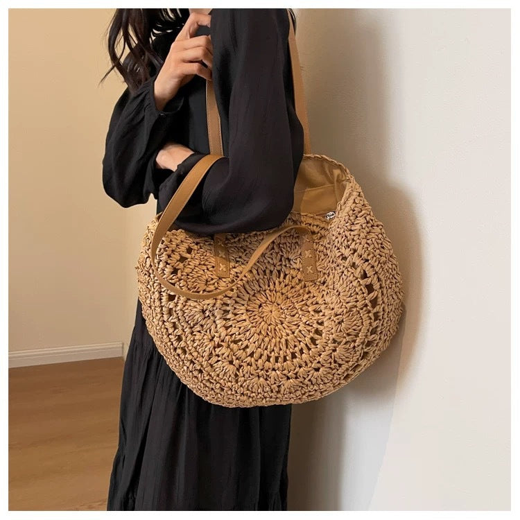 Round-woven beach bag with leather handles Stornfield