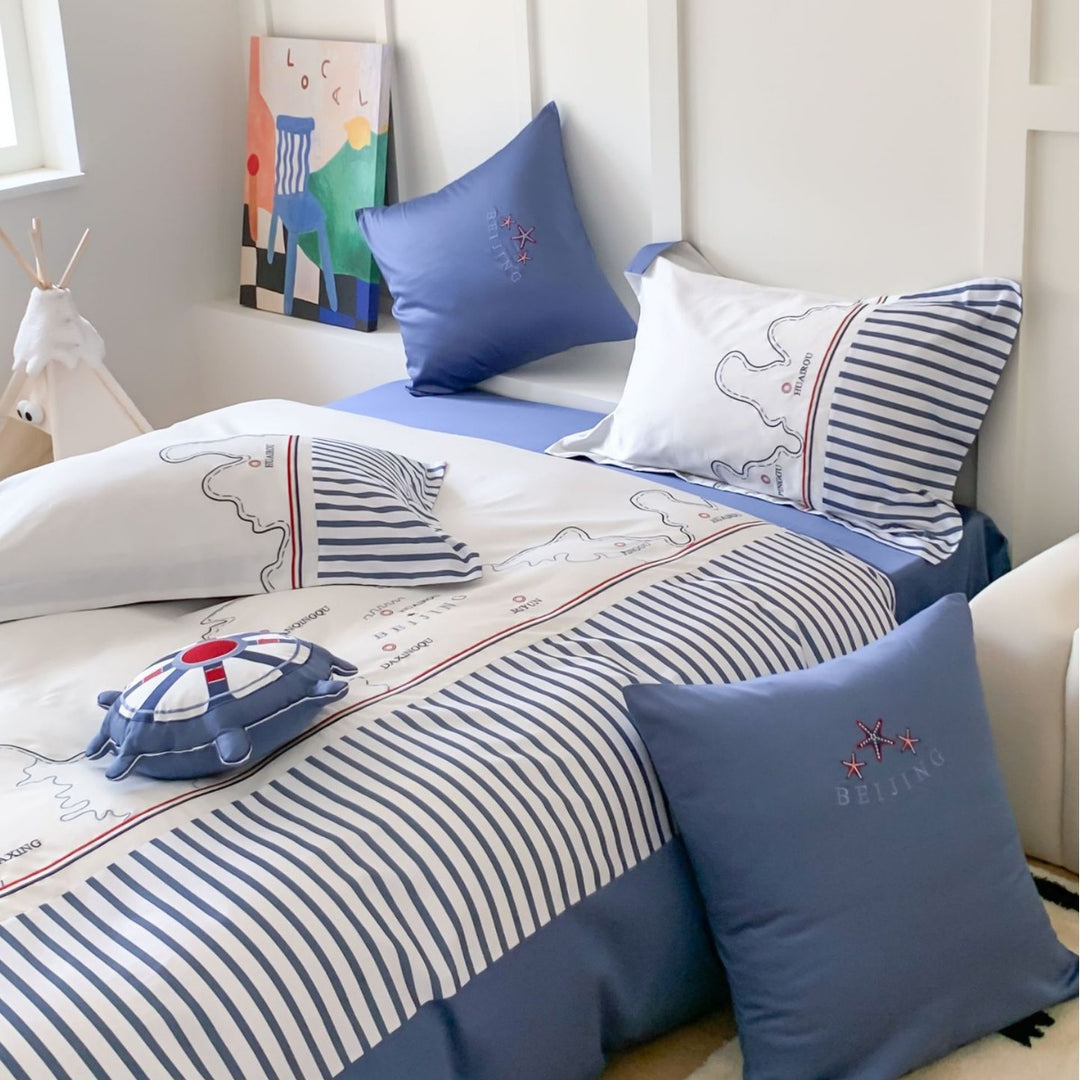 Maritime children's duvet cover set with cartographic print, fine striped border and pillowcases