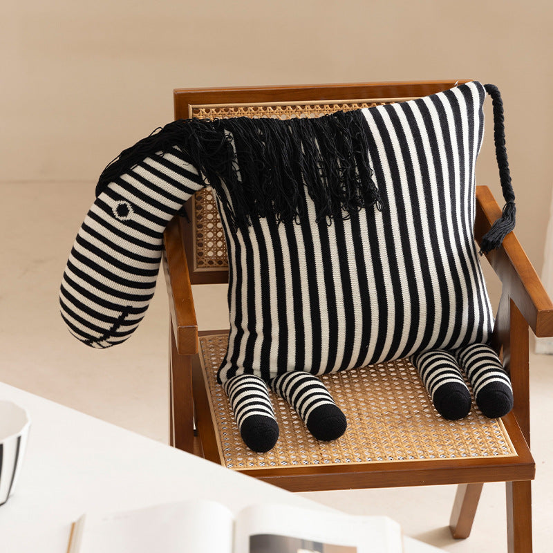 Striped decorative knitted cushion in animal shape with fringes and four-legged look Stornfield