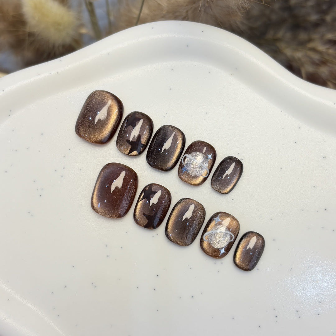 Artificial nail set with star and planet design Stornfield
