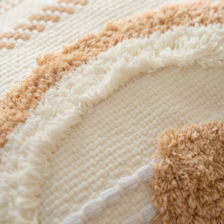Square decorative cushion with boucle relief, zigzag and diamond pattern as well as tassels