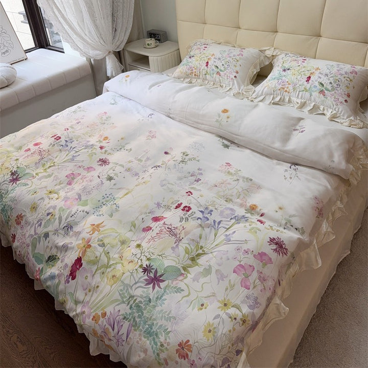 Cotton satin bed linen set with delicate watercolor botanical print and decorative ruffle