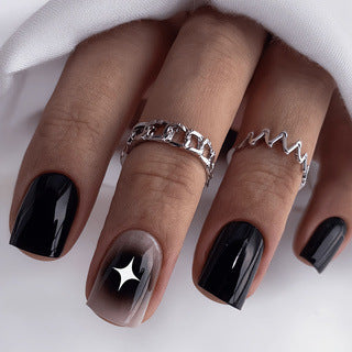 Artificial nails in elegant black with gloss and creative accents Stornfield