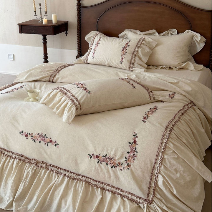Romantic bedding set with ruffles and floral embroidery in linen look