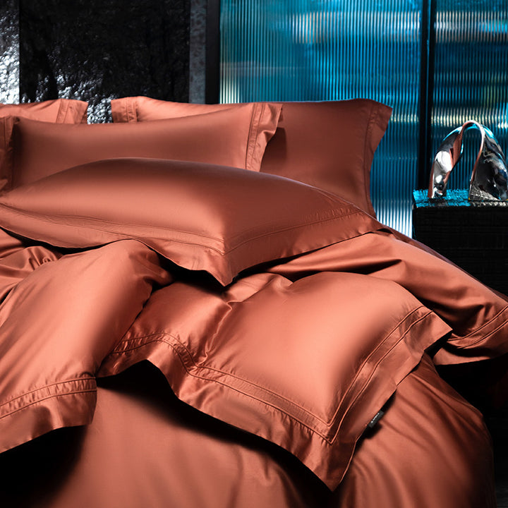 Exclusive cotton satin bedding set with a silky touch, double seam piping, and hotel closure