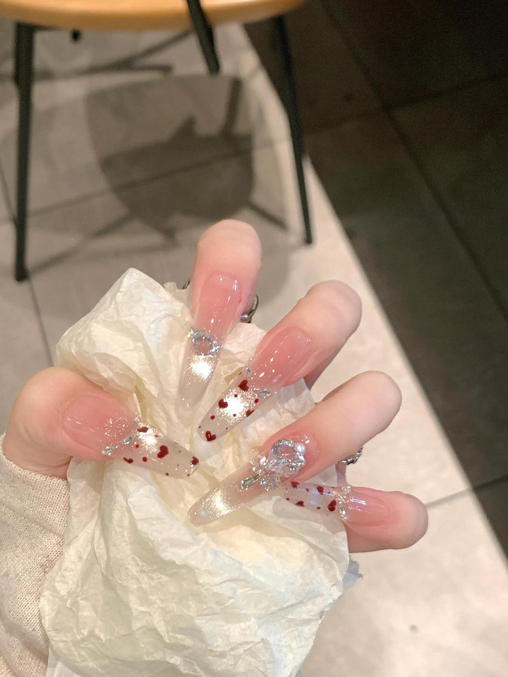 Nail art set with sparkling rhinestones and heart design Stornfield