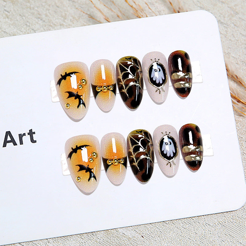 Artificial nails with Halloween motifs and glitter details Stornfield
