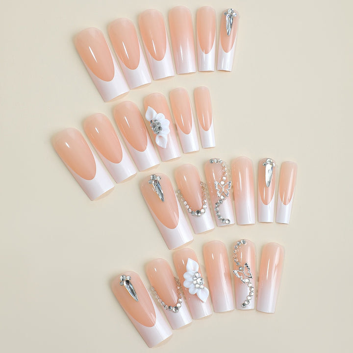 Acrylic nail set with elegant 3D accents and glitter decorations Stornfield