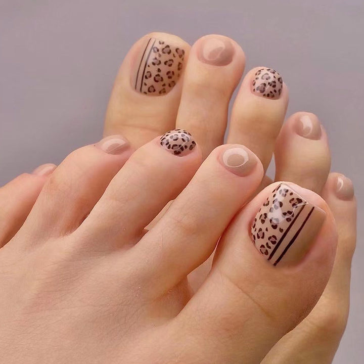 Artful toenail design with leopard pattern and modern lines Stornfield