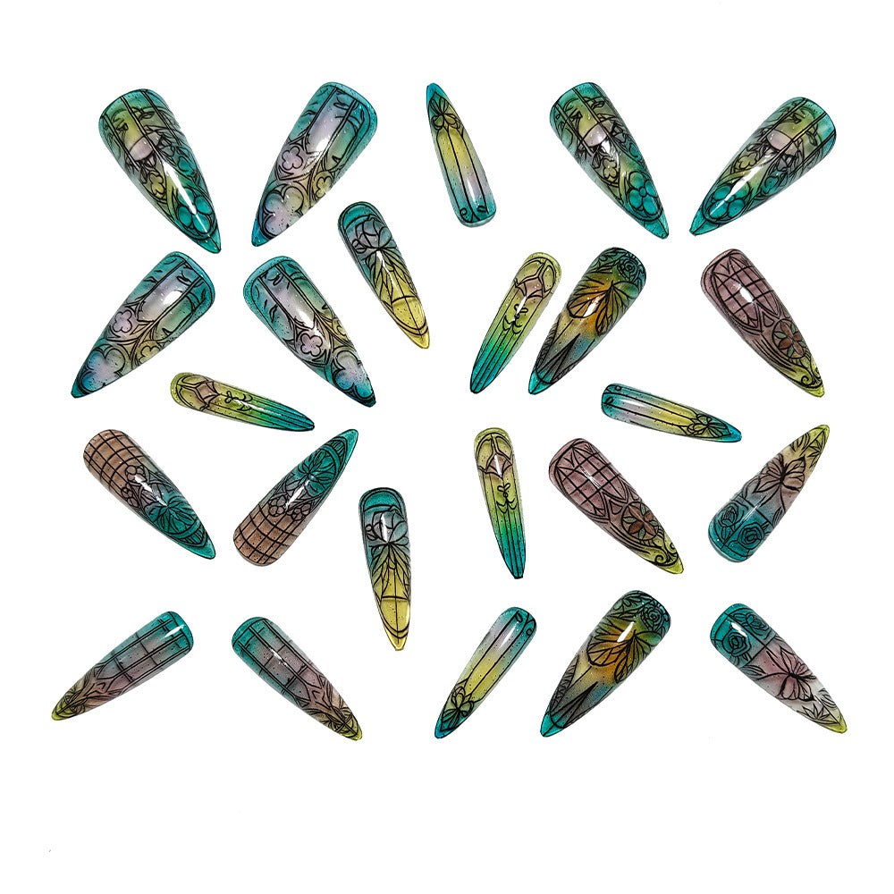 Artificial nails in elegant stiletto design with elaborate motifs Stornfield