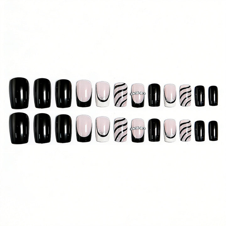 Artificial nail set with glamorous glitter and stripe designs Stornfield
