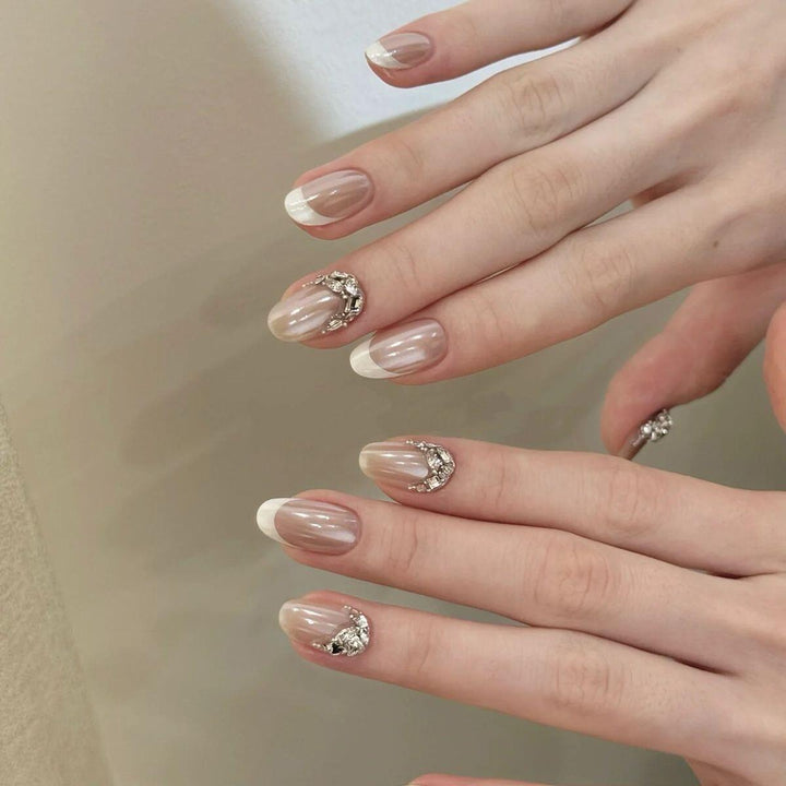 Glamorous artificial nails with elegant rhinestone decorations Stornfield