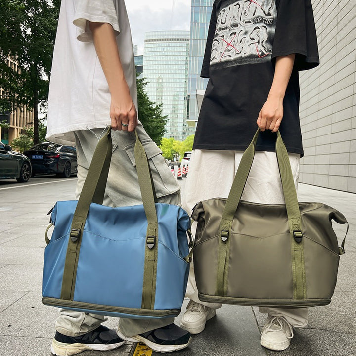 Sporty shoulder bag with water-repellent material and sturdy carrying handles Stornfield