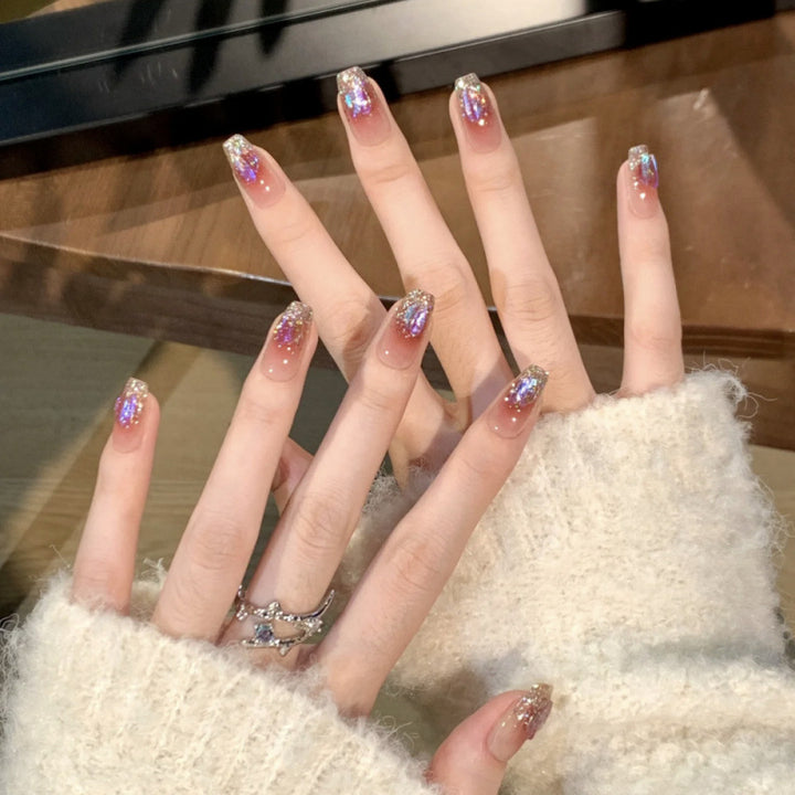 Glamorous artificial nails with glitter effects Stornfield
