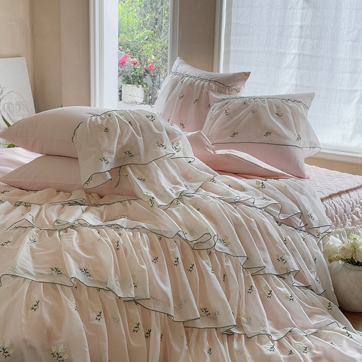 Vintage-inspired ruffle bed set with fine floral embroidery and ruched coverlet