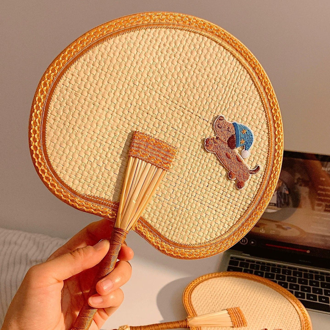Handcrafted fan with playful dog motif Stornfield