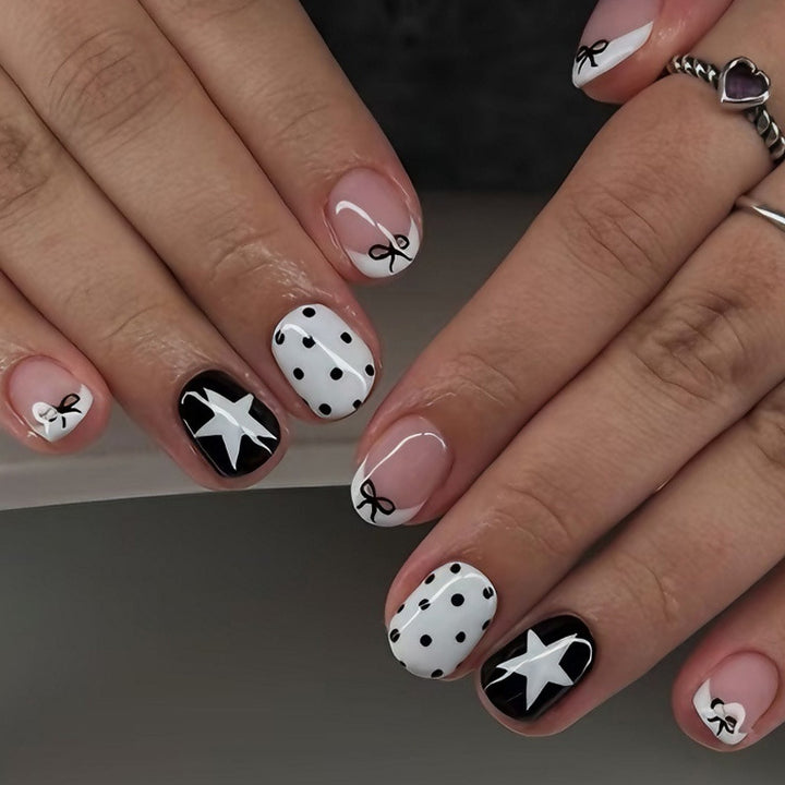 Acrylic nail set with playful dots and star motifs Stornfield