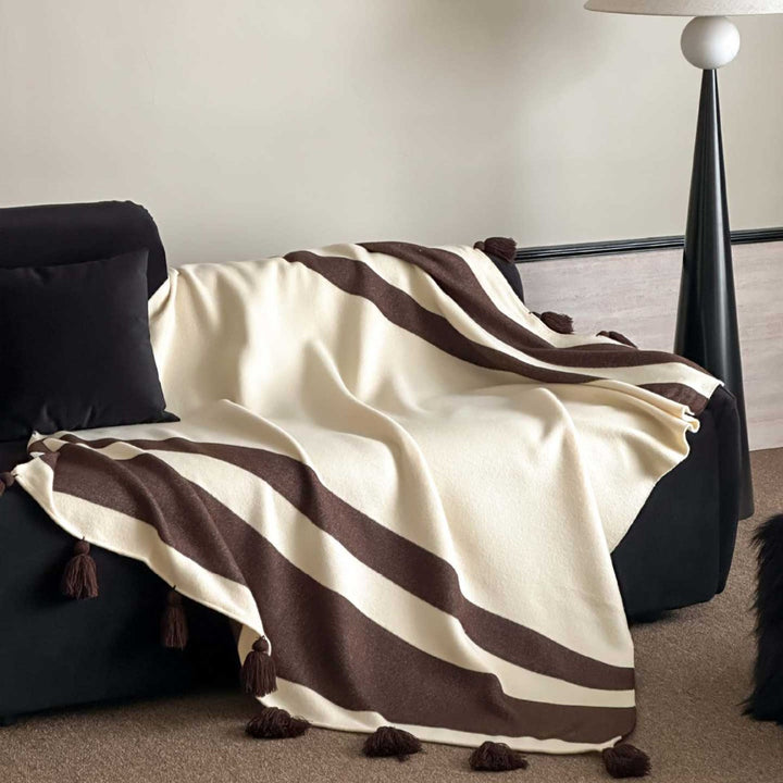 Throw blanket with tassels and wide stripe pattern