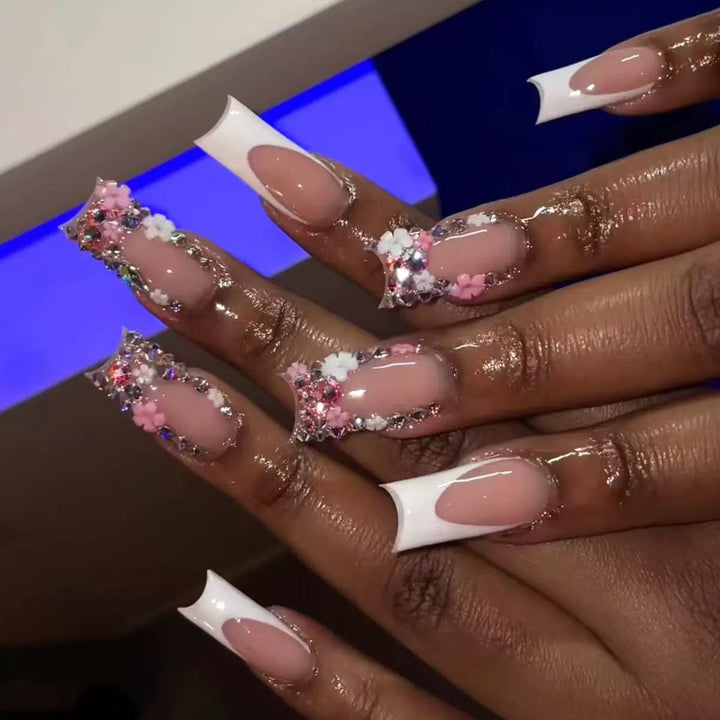 Artificial nail set with elegant 3D flowers and glitter embellishments Stornfield