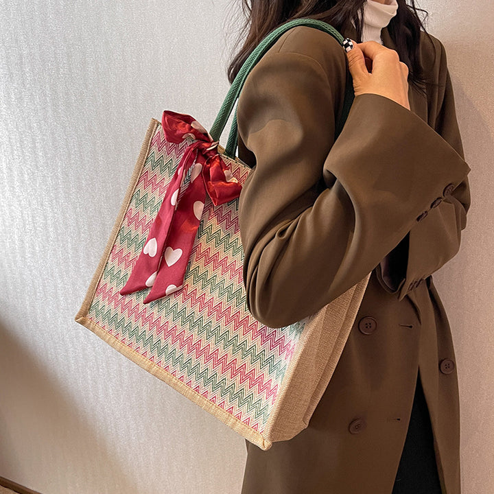 Textured Handbag with Decorative Bow