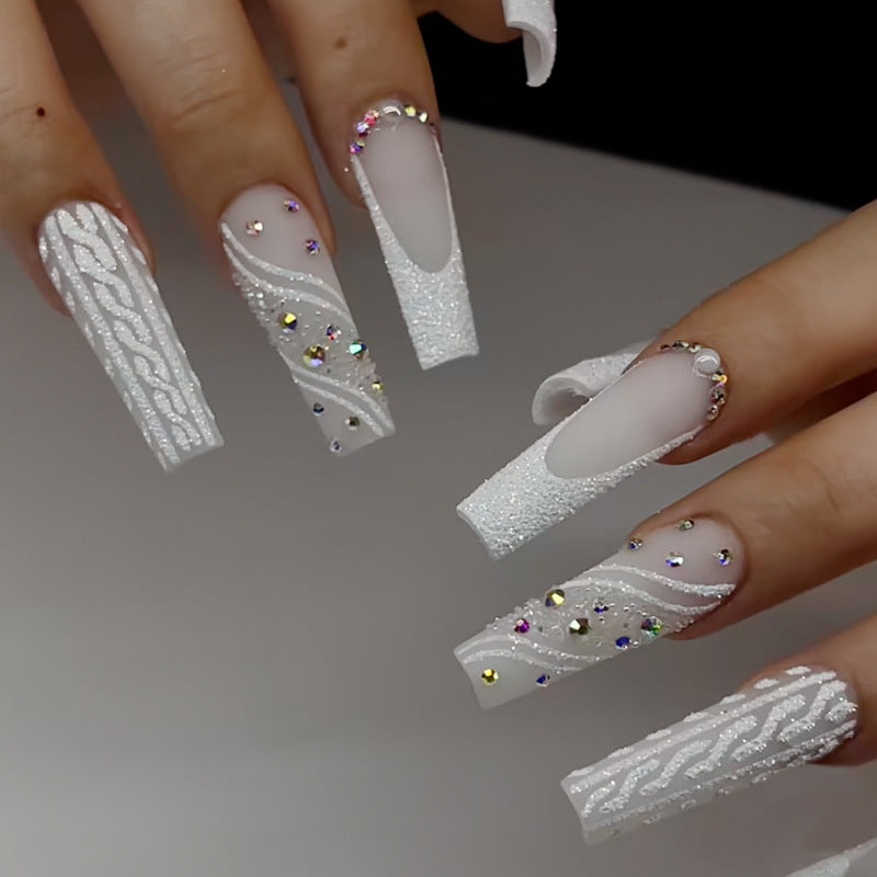 Artistic Press-On Nail Design with Rhinestone and Embellishments Stornfield