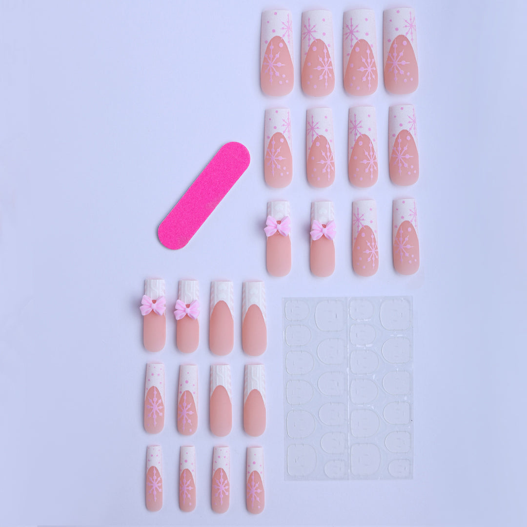 Artificial nail tips with playful bows and snowflake design Stornfield