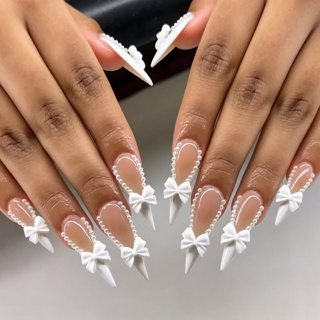 Elegant Bow-Embellished Nail Art Stornfield