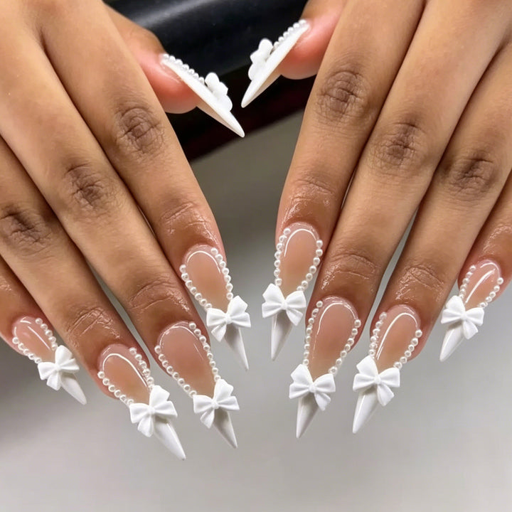 Elegant Bow-Embellished Nail Art Stornfield