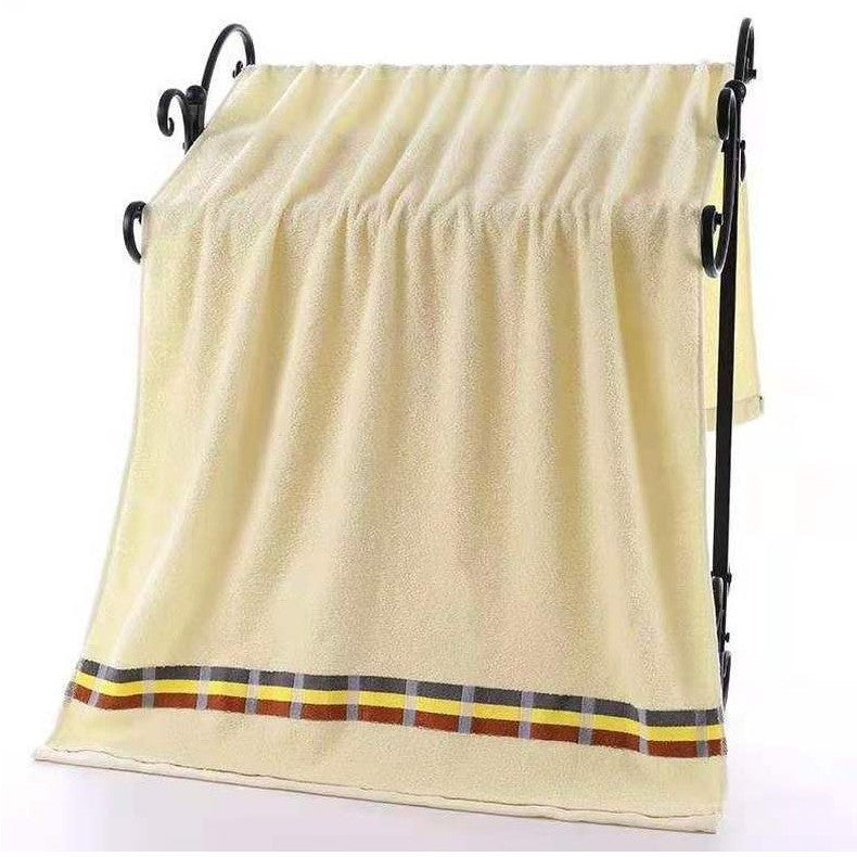 Women’s terry bath towel with elegant striped border Stornfield