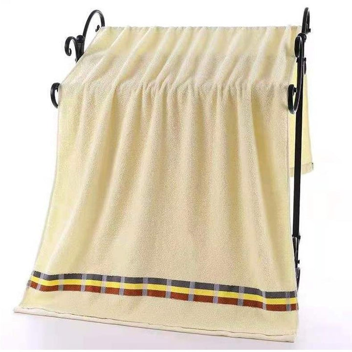 Women’s terry bath towel with elegant striped border Stornfield