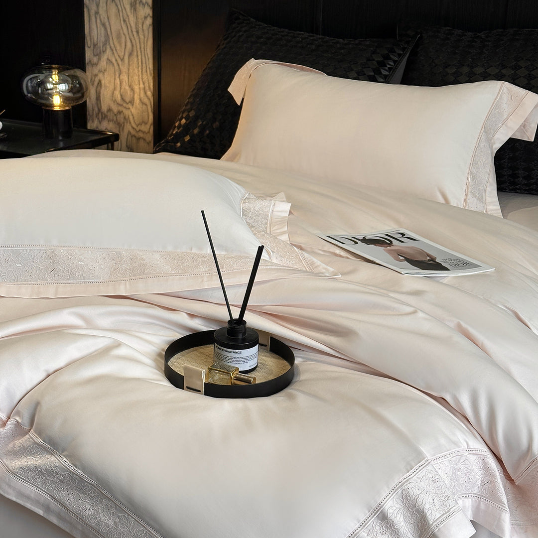 Premium cotton satin bedding set with integrated lace trim and delicate floral embroidery