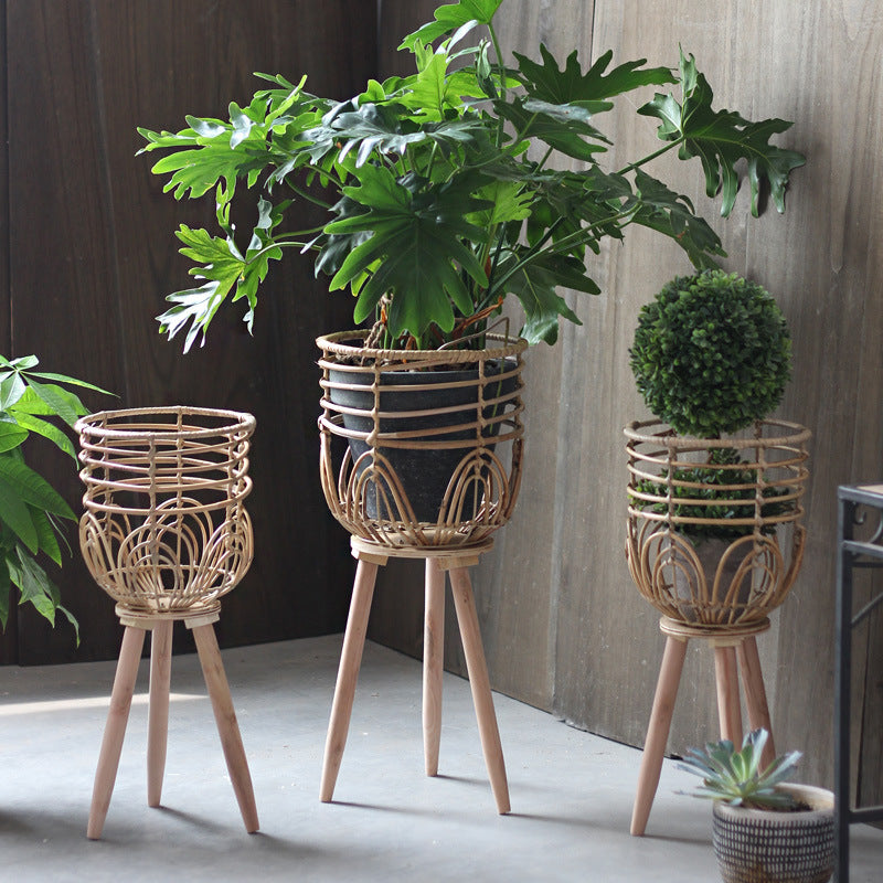 Stylish plant stand made of rattan and wood Stornfield