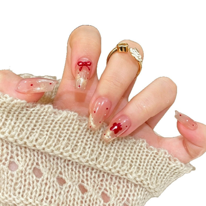 Artificial nails with sparkling accents and delicate patterns Stornfield
