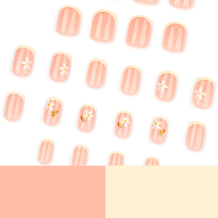 Artificial nail art with flower and bee motifs Stornfield