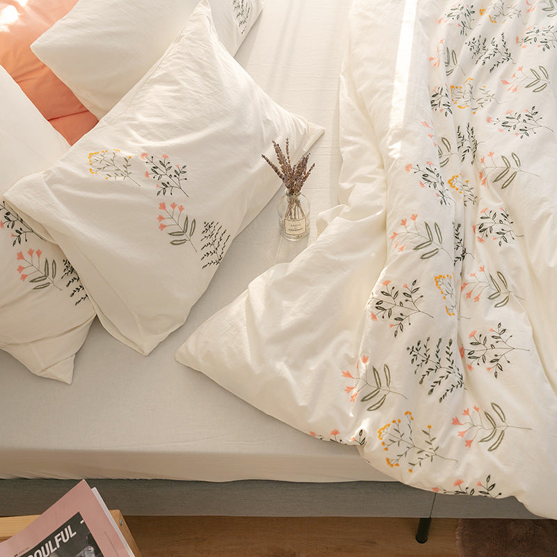Embroidered cotton muslin bedding set with delicate flower appliqués and extra soft fitted sheet