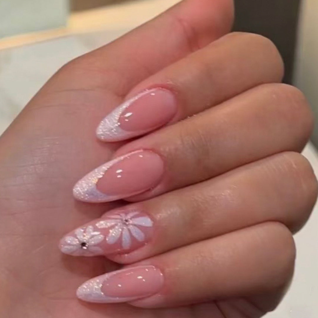Elegant artificial nails with floral design and glitter embellishments Stornfield