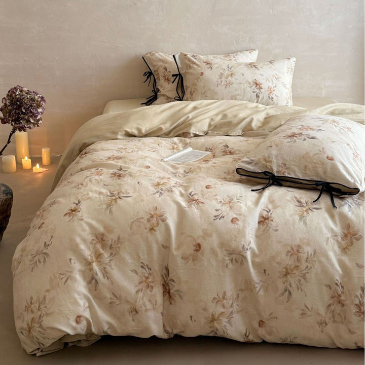 Bedding set made of cotton-linen with delicate watercolor floral print and decorative tying ribbons