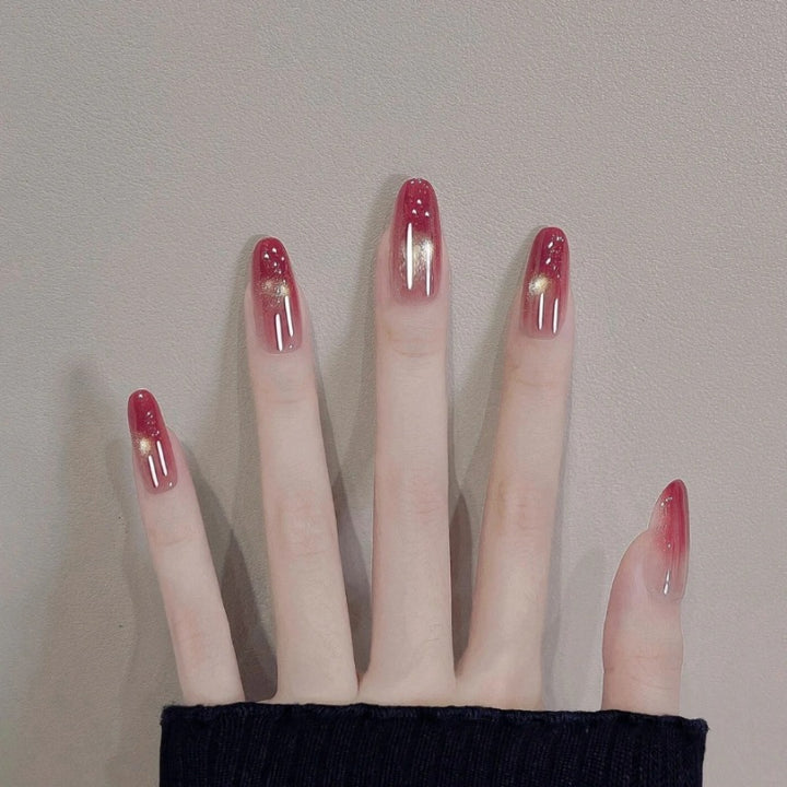 Glossy Ombre Nail Extensions with Gold Accents