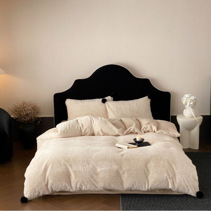 Bedding set made of soft cotton blend with decorative pom poms and reversible back