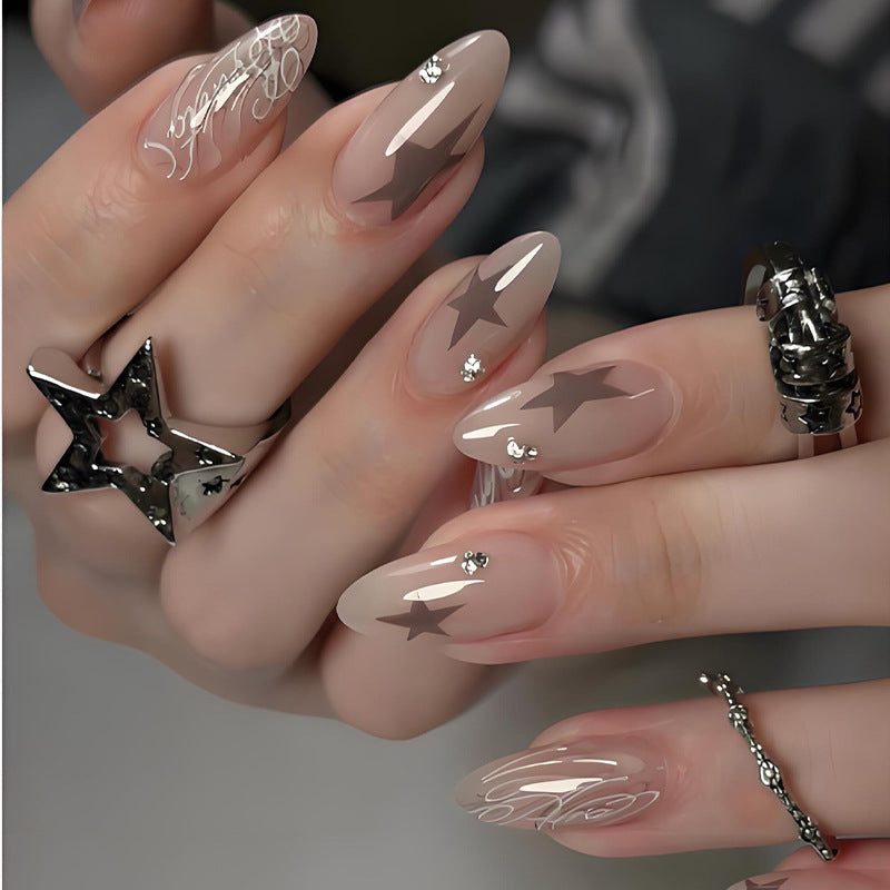 Artificial nail set with elegant star motifs and glitter accents Stornfield