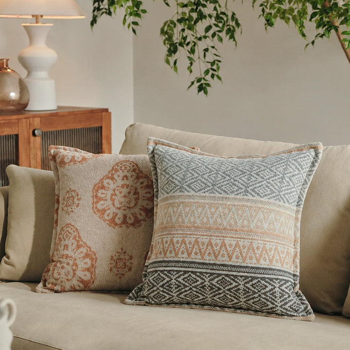 Square decorative sofa cushion with jacquard-woven ornament and soft bouclé surface Stornfield
