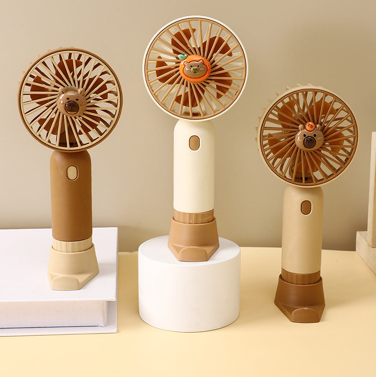 Cooling portable rechargeable handheld mini fan with detachable base stand cute animal-face safety grille USB-C charging Stornfield