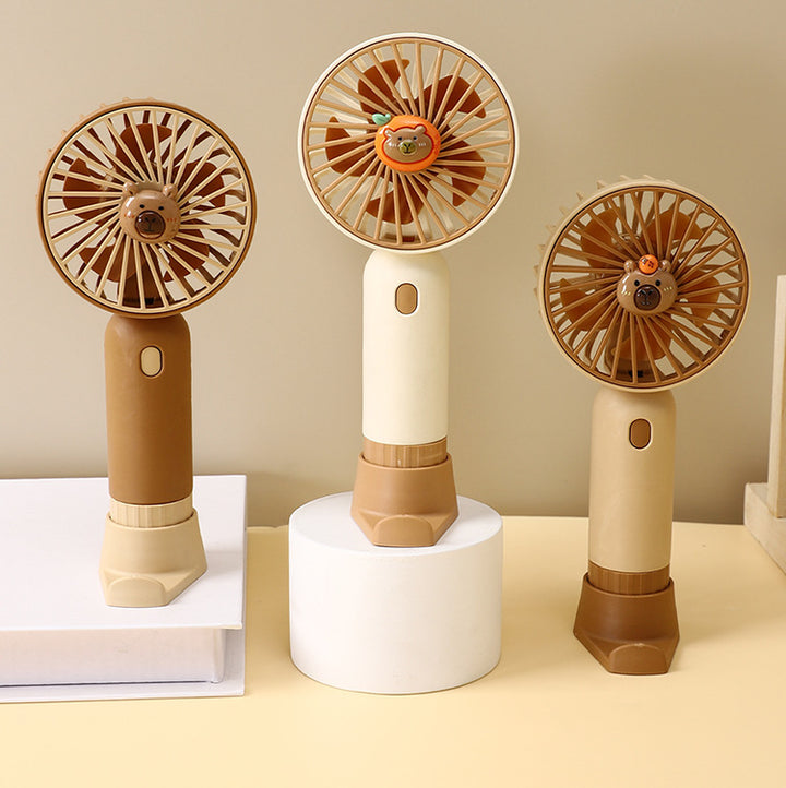 Cooling portable rechargeable handheld mini fan with detachable base stand cute animal-face safety grille USB-C charging Stornfield