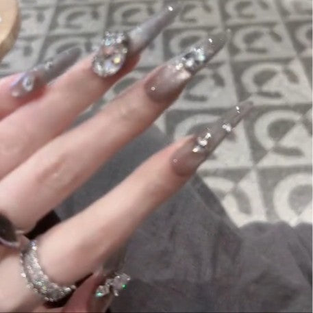 Glamorous artificial nails with rhinestone accents Stornfield