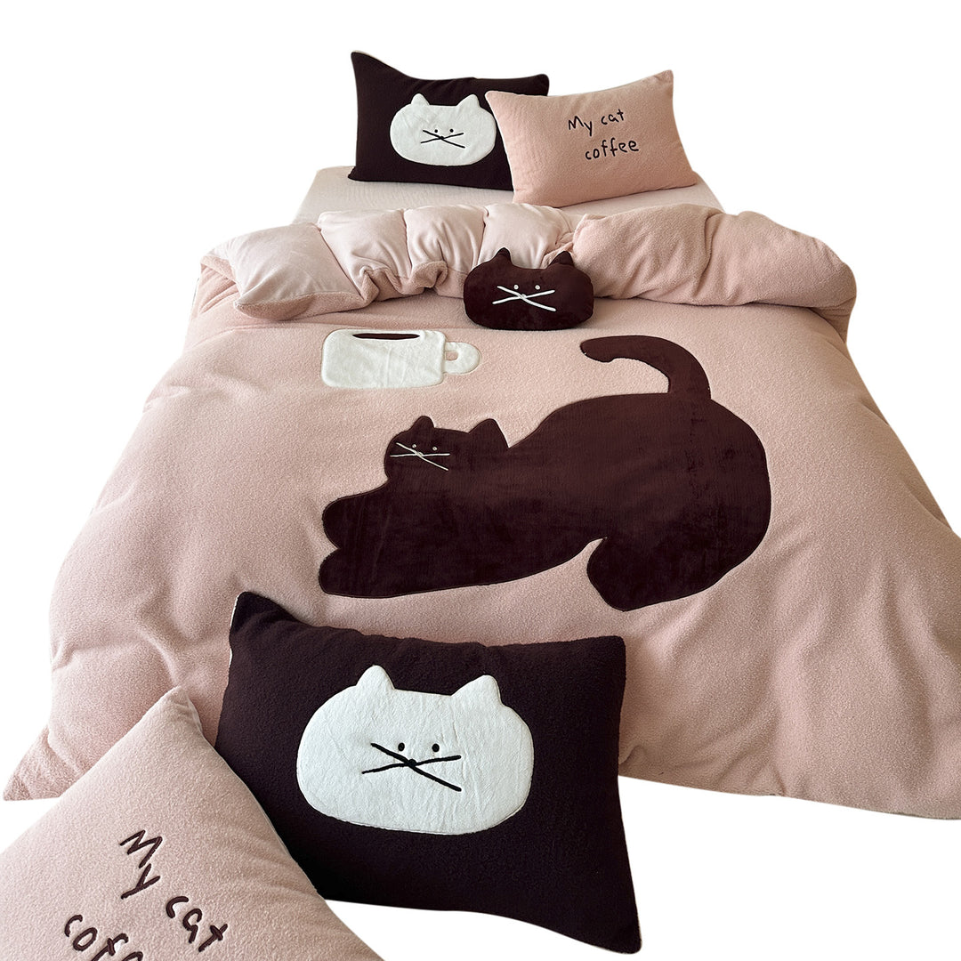 Cozy bedding set with embroidered cat appliqués and soft fleece surface