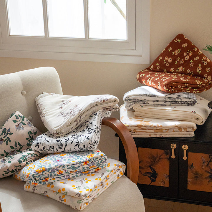 Organic Cotton Muslin Swaddle Blanket with Playful Cartoon Print