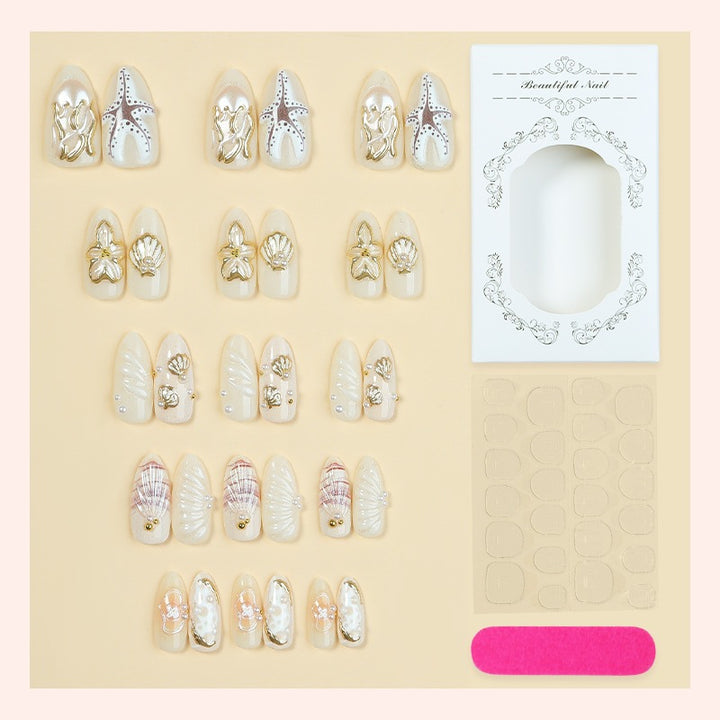 luxurious artificial nail set with maritime designs and golden accents Stornfield