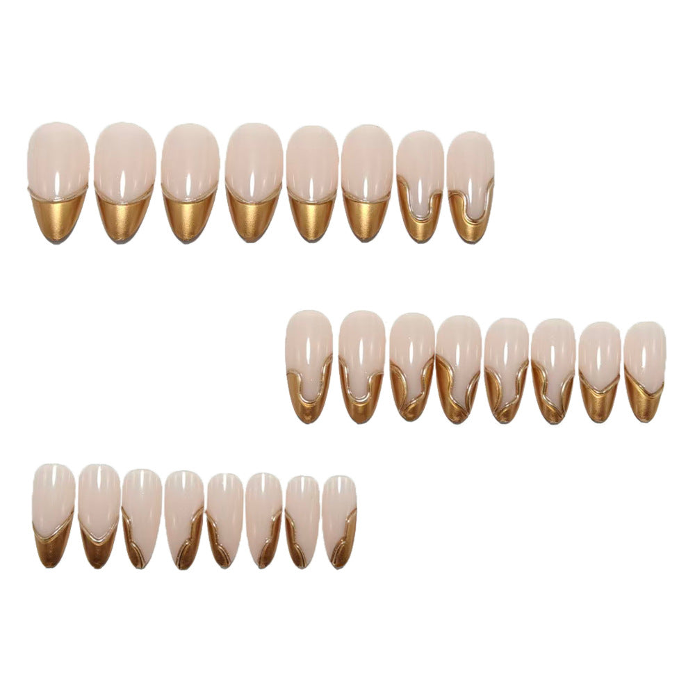 Artificial nails in elegant stiletto design with gold accents Stornfield
